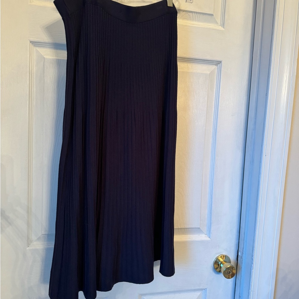 A-line Navy knit skirt with gold buttons. New without tags